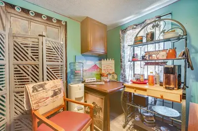 a kitchen with a desk and a chair in a room at 7 Mi to Cuyahoga Valley NP Walkable Apt! in Cuyahoga Falls