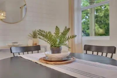 a table with a potted plant on top of it at The Heron House