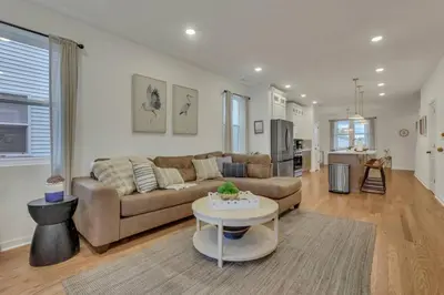 a living room with a couch and a table at The Heron House