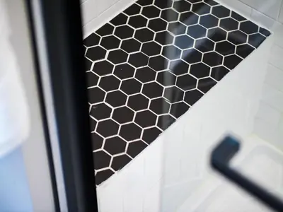a shower door with a honeycomb pattern on it at The Modern Boho Brick Loft in Cleveland