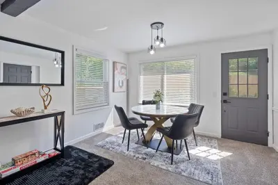 a dining room with a table and chairs at Luxury 5BR Cincinnati, Sleeps 12, Crib, Home Gym, Fenced Backyard in Cincinnati