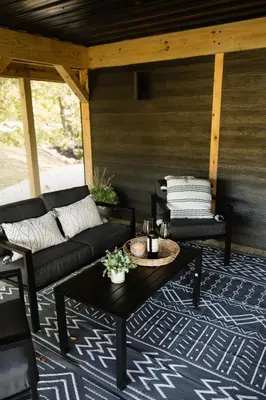 a porch with a couch and a coffee table at The Alto in Logan
