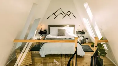 a bedroom with a bed in a attic at The Pinnacle in Logan