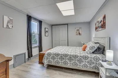 a bedroom with a bed and a window at 5 Mi to The Wilds Spacious Family Hub, Game Room!