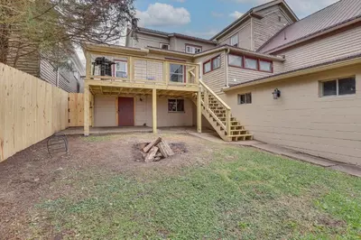 a house with a stairway leading to a garage at 5 Mi to The Wilds Spacious Family Hub, Game Room!