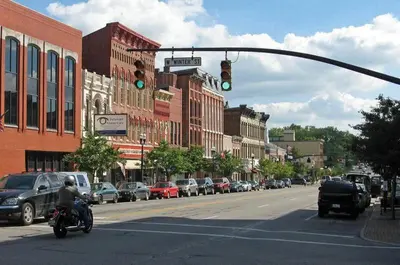 a person riding a motorcycle under a green traffic light at Downtown 3 Bed Loft Apartment in Delaware