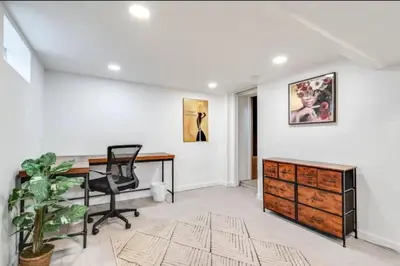an office with a desk and a dresser at Cozy Old Brooklyn Home near Zoo in Cleveland