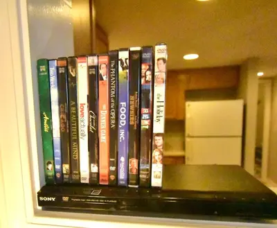 a row of books sitting on a shelf at Tremont apartment, near downtown, and Central! in Cleveland