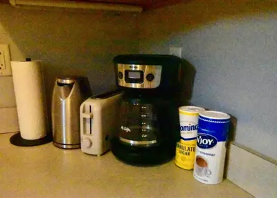 a coffee maker sitting on top of a kitchen counter at Tremont apartment, near downtown, and Central! in Cleveland
