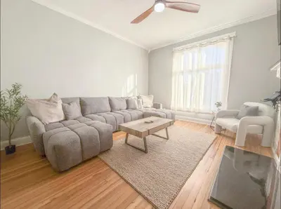 a living room with a couch and a table at Spacious Home Downtown - Children's Hospital, Pets in Columbus