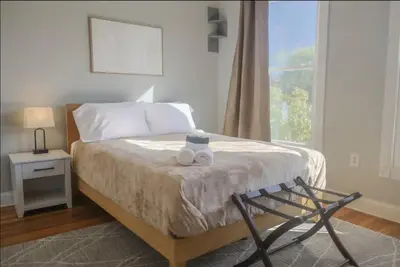 a bedroom with a bed with two towels on it at Spacious Home Downtown - Children's Hospital, Pets in Columbus