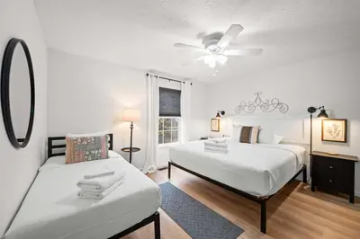 a bedroom with two beds and a ceiling fan at Near Ark Private Parking Patio 2 bed 1&half Bath in Dry Ridge