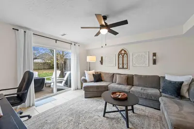 a living room with a couch and a ceiling fan at Near Ark Private Parking Patio 2 bed 1&half Bath in Dry Ridge