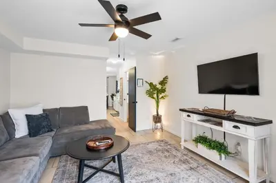 a living room with a couch and a ceiling fan at Near Ark Private Parking Patio 2 bed 1&half Bath in Dry Ridge