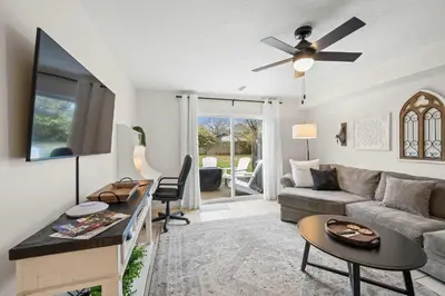 a living room with a couch and a tv at Entire Duplex Close to ark with Private Parking in Dry Ridge