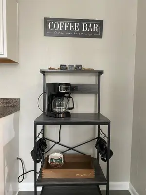 a coffee bar cart with a coffee maker on it at Beautiful Waterfront Ranch in Erie
