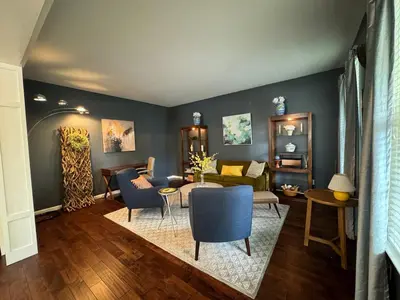 a living room with a couch and a table at Battlefield Getaway in Monroe