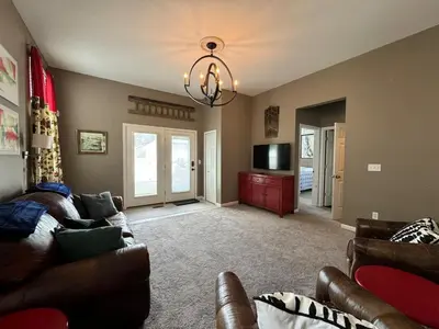 a living room with a couch and a television at Battlefield Getaway in Monroe