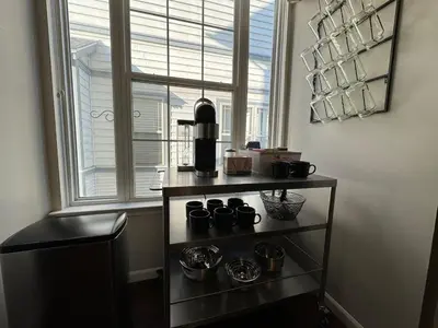 a shelf with a coffee maker in front of a window at Battlefield Getaway in Monroe