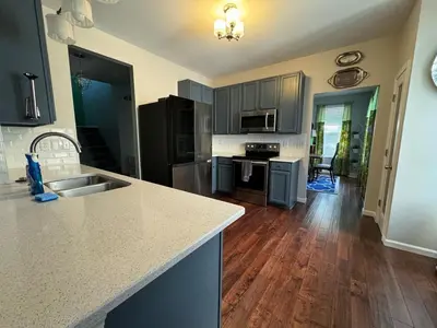 a kitchen with a sink and a counter top at Battlefield Getaway in Monroe