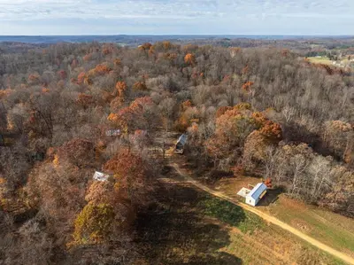 an aerial view of a house in the middle of a forest at The Primrose in Logan