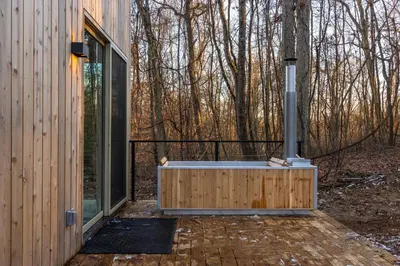 a bath tub sitting outside of a house at The Klover in Logan