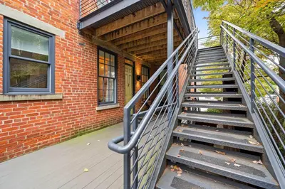 a staircase leading up to a brick building at Free Downtown Parking Walk to Stadiums and Shopping in Covington
