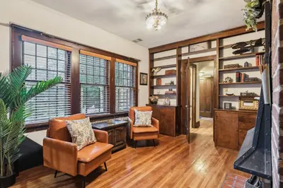 a living room with two chairs and a desk at Steps to Edgewater - Sleeps 14 - Fun Game Room Retreat in Cleveland
