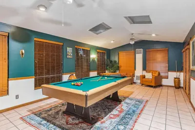 a living room with a pool table in it at Steps to Edgewater - Sleeps 14 - Fun Game Room Retreat in Cleveland