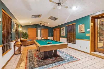a living room with a pool table in it at Steps to Edgewater - Sleeps 14 - Fun Game Room Retreat in Cleveland