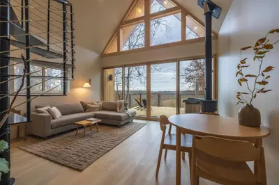 a living room with a couch and a table at The Ffern in Logan