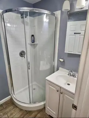 a bathroom with a shower and a sink at Family size house in Reynoldsburg