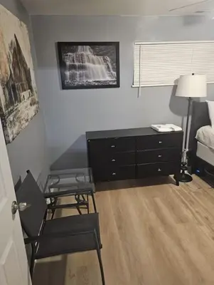a room with a desk and a chair and a bedroom at Family size house in Reynoldsburg