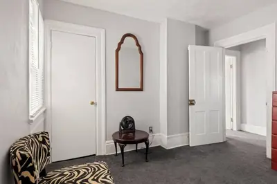 a room with a zebra print chair and a mirror at W38 Front in Cleveland