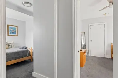 a bedroom with a bed and a mirror at W38 Front in Cleveland