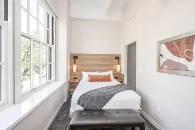 a bedroom with a bed and a window at The 333 Suites - For 24 Guests in Cincinnati