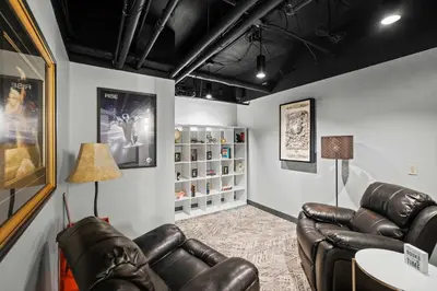 a waiting room with leather chairs and a table at The 333 Suites - For 24 Guests in Cincinnati