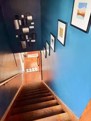 a stairway with blue walls and a blue wall at 3 Bedroom Home, near downtown, Tremont, Ohio City! in Cleveland