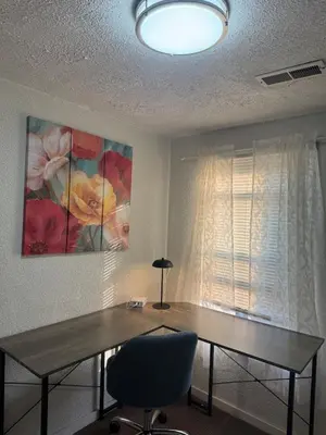 a dining room table with a lamp and a window at Cozy 3 4 BR Home Ideal for Family in Clarksburg