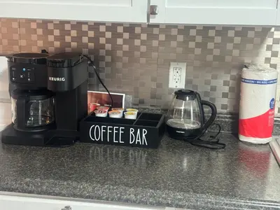 a coffee bar sign on top of a kitchen counter at Cozy 3 4 BR Home Ideal for Family in Clarksburg