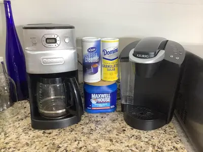 a coffee maker on a counter next to some spices at 2 bedroom Loft apartment near downtown, Ohio city, Tremont! in Cleveland