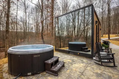 a jacuzzi tub sitting on top of a patio at The Mirage Escape in New Plymouth