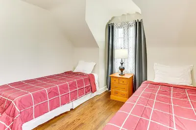 a bedroom with two beds and a window at Inviting Family Home, 2 Mi to Eastwood Mall! in Niles