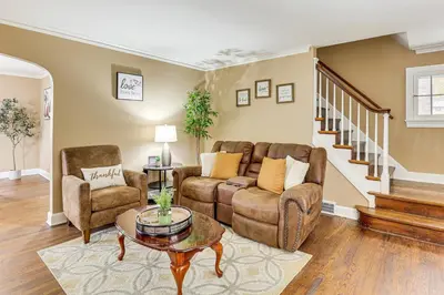 a living room with a couch and chairs and a table at Inviting Family Home, 2 Mi to Eastwood Mall! in Niles