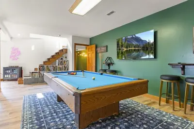 a pool table in a room with green walls at Giant Property w Sledding Hills and Golf in Logan
