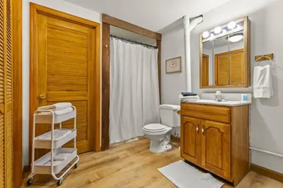 a bathroom with a toilet and a sink and a mirror at Giant Property w Sledding Hills and Golf in Logan