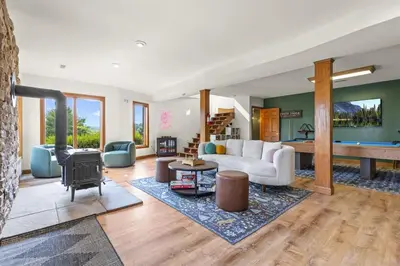 a living room with a couch and a table at Giant Property w Sledding Hills and Golf in Logan
