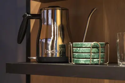 a coffee pot sitting on top of a shelf at The Illusion Hideaway in New Plymouth