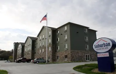 a building with a flag on top of it at Suburban Studios Washington, PA in Washington