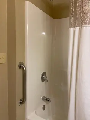 a shower in a bathroom with a shower curtain at Suburban Studios Washington, PA in Washington